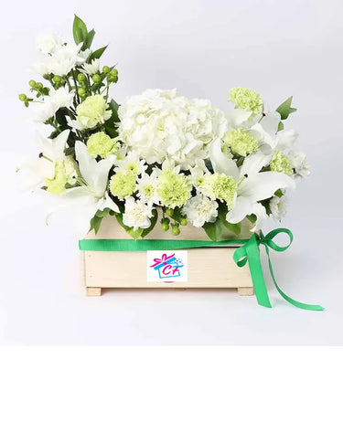Peaceful Blessings, Floral Harmony Arrangement, White Hydrangea, White Oriental Lilies, Green Carnations, White Carnations, White Chrysanthemums, Green Hypericum, Single Ruscus, Wooden Box, Ribbon Bow